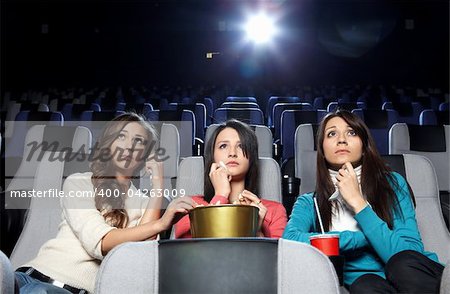 Lovely girls cry at viewing at cinema