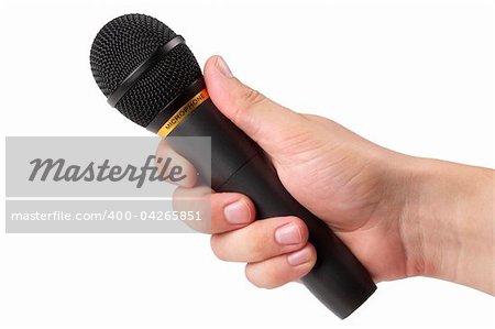 Black microphone in the hand isolated over white background