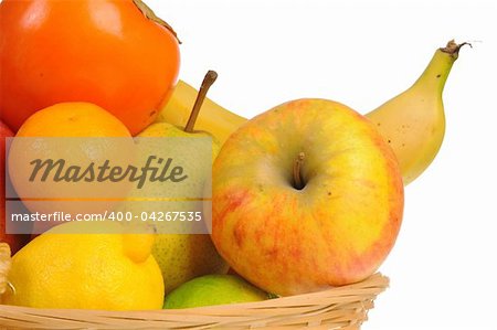 Basket with fresh fruit isolated on white background
