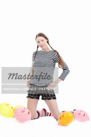 a pretty girl dressed in casual clothes playing with baloons