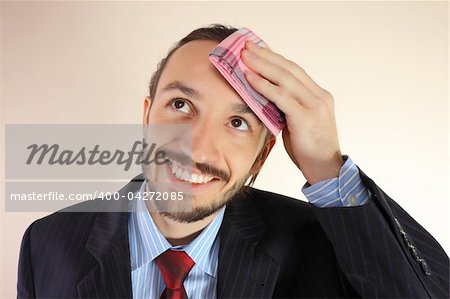 The businessman wipes a forehead by kerchief