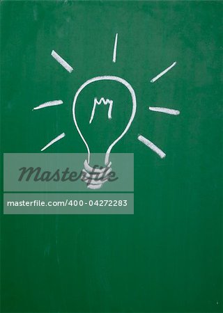 close up of a light bulb drawing on blackboard
