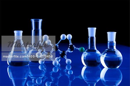 Laboratory Glassware in blue table in laboratory