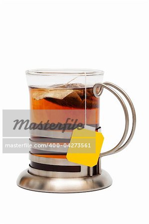 Tea in a glass with a cup holder on a white background