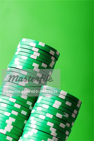 Stack of casino chips against green background