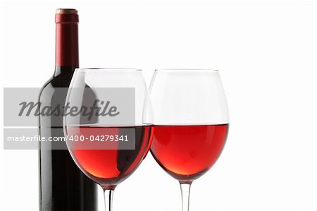 Two glasses of red wine and a bottle isolated