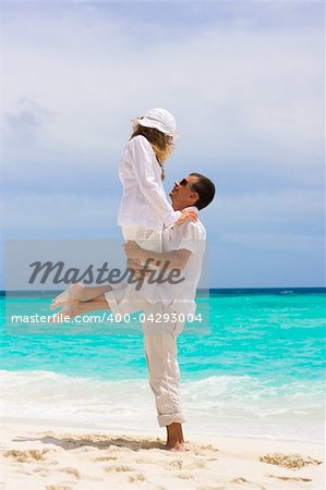 Happy young couple on a tropical beach