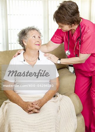 Nurse helps senior woman.  Could either be in-home care or at a nursing home or assisted living facility.
