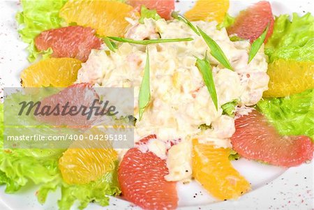 seafood salad of shrimp baked at cream with orange and grapefruit isolated on a white background