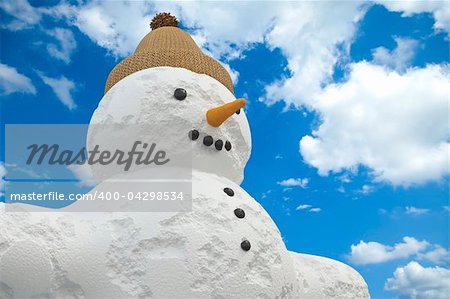 Snowman in front of a cloudy sky