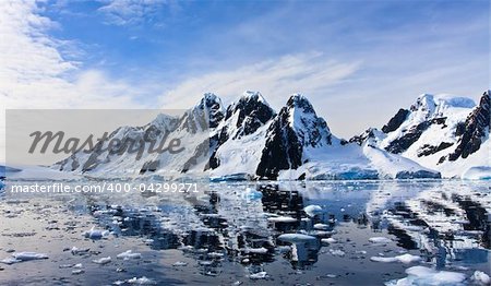 Beautiful snow-capped mountains against the blue sky in Antarctica