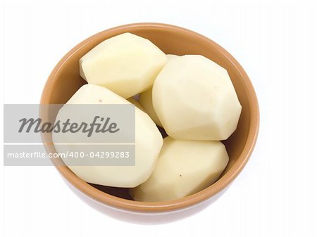 The a little well cleared potatoes are located in a plate which is on a white background