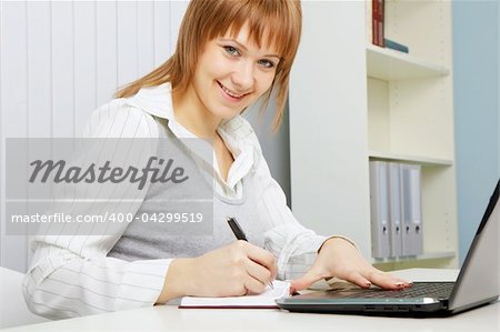 attractive young woman. Office worker with a laptop