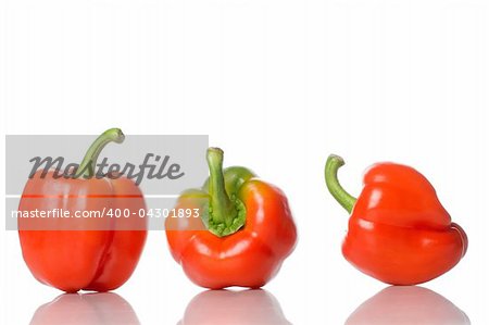 group of red peppers on white background