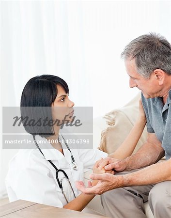 Man talking with his nurse on the sofa