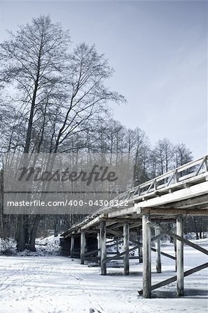 wooden bridge in winter on a white background