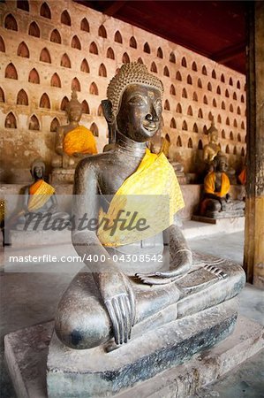 Ancient Buddha sculptures in the cloister of Wat Si Saket in Vientiane, Laos