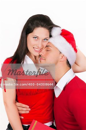 young couple in love dressed in red christmas clothes