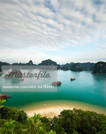 Ha Long Bay  is a UNESCO World Heritage Site, and a popular travel destination. Picture from top of a mountain.