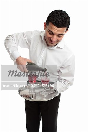 A waiter or butler pouring sparking red wine into glasses.  White background.