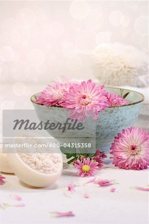 Spa scene with  chrysanthemum flowers in water and soap