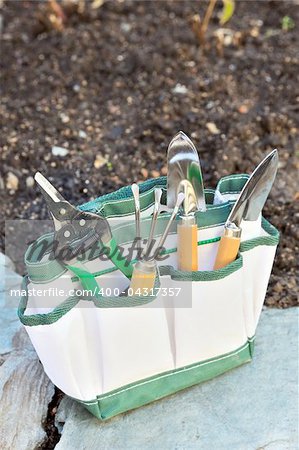 Detail of gardening tools in tool bag - outdoor