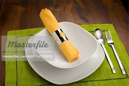 photo of wood table with dishes which is ready to be seated for lunch