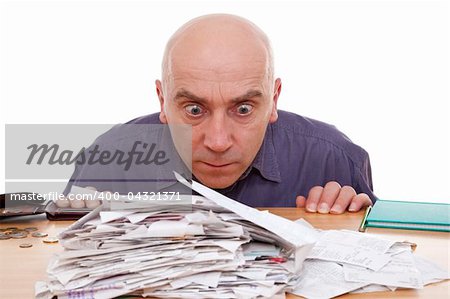 heap of receipts and terrified man
