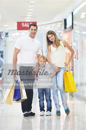 Young family with their bags at the store