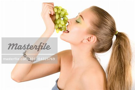 Pretty young woman with grape on the white background