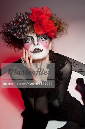 Woman mime with theatrical makeup. Studio shot.