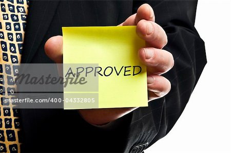 Approved post it in business man hand