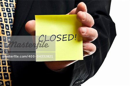 Closed post it in business man hand