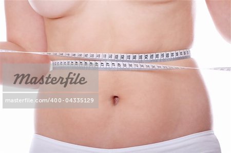 Female measuring her body, isolated on white