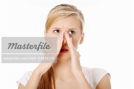 Young woman with sinus pressure pain , isolated on white