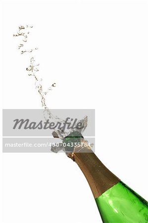 Bottle of champagne with splashes over white background