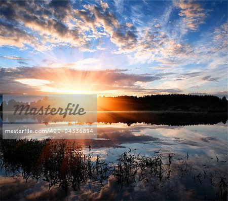 Dawn over the surface of a lake.