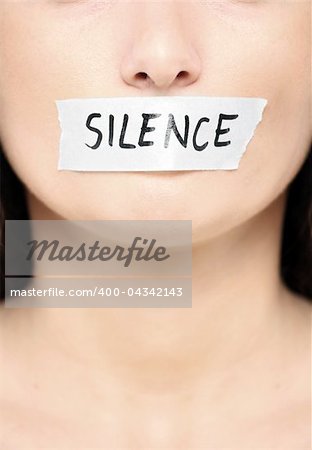 A picture of a female face with a tape on her mouth and a notice "silence"
