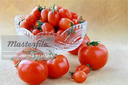 different varieties of tomatoes in a crystal vase