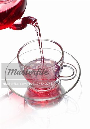 tea being poured into glass tea cup