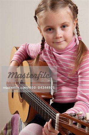 Young girl play classical guitar