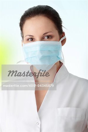 Young nurse or doctor in mask