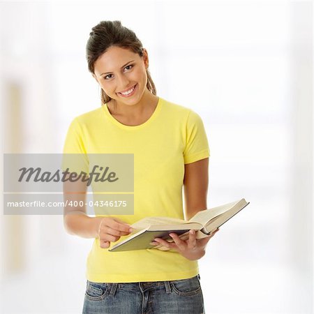 Teen woman reading book