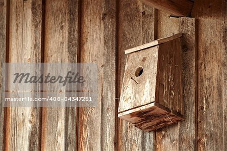 homemade birdhouse on the wall