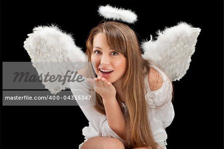 beautiful blonde angel woman against black background