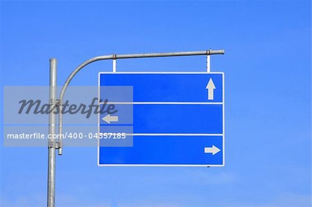 Blank road sign, three arrow blue with clear sky ready for your custom text .