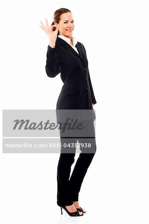 young businesswoman with her hand indicating ok on white background studio