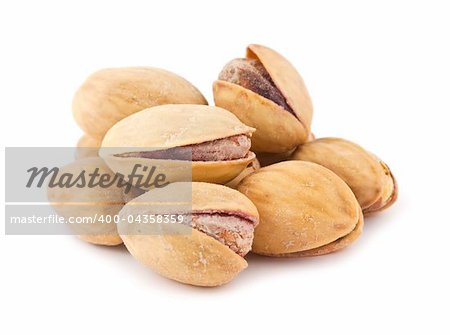 Dry salted pistachio nuts isolated on white background