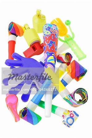 Assorted party noisemakers on white background