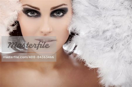 Young brunette lady with fans isolated on white background